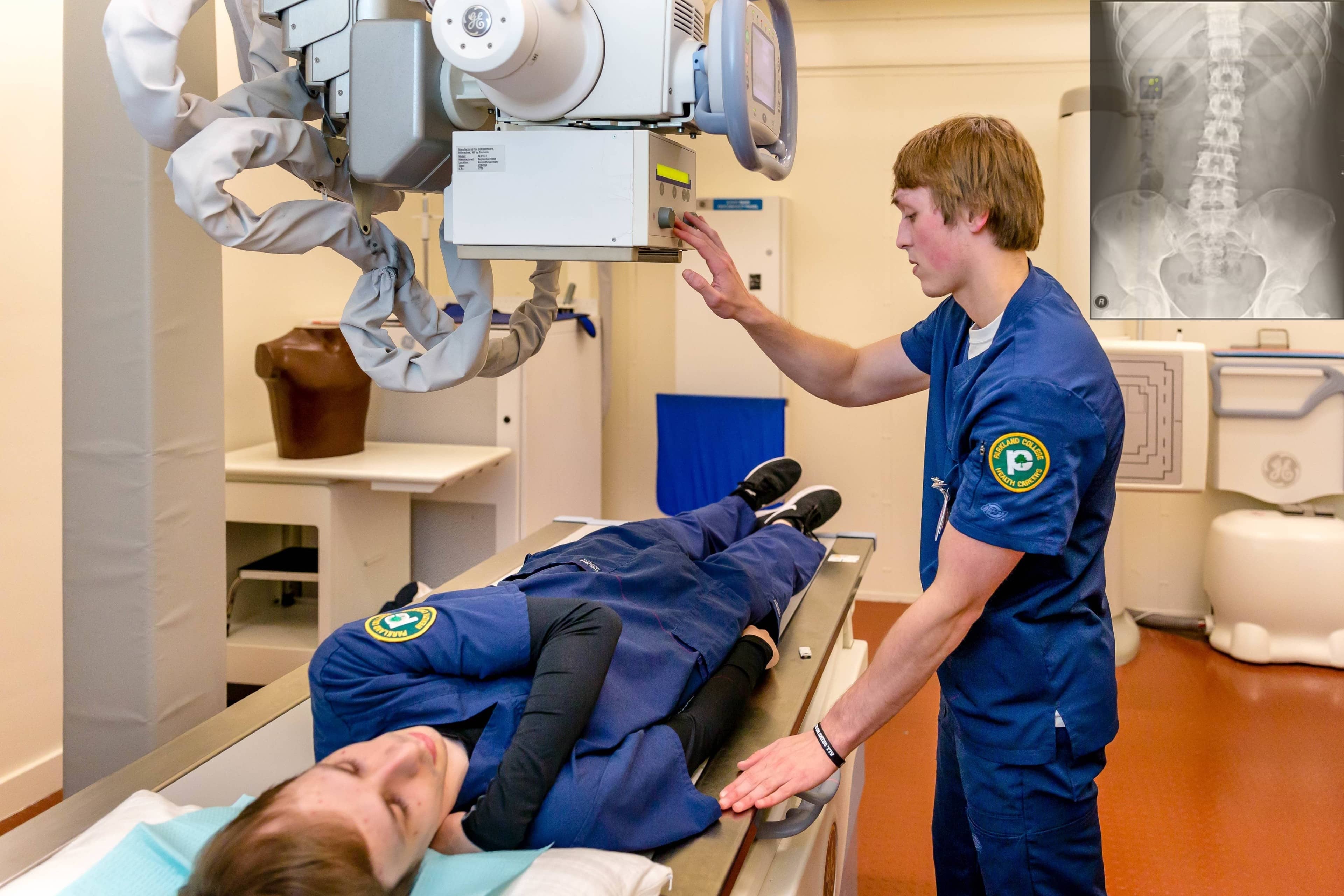 student taking X ray of patient